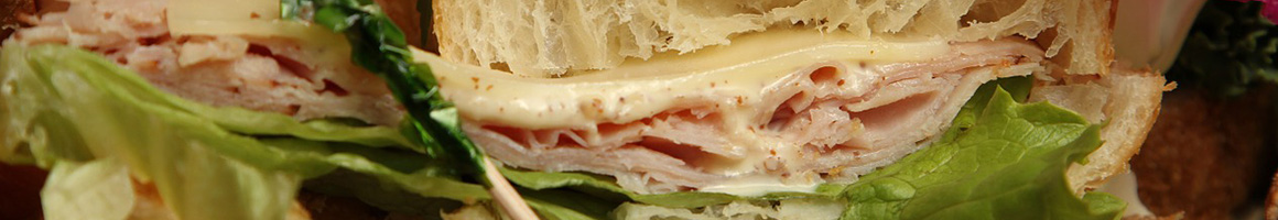 Eating Deli Sandwich at Tropical Oasis restaurant in Chula Vista, CA.
